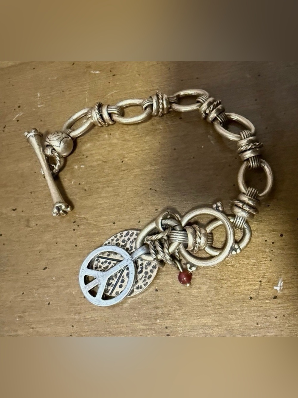 Gold-Tone Lucky Brand Charm Bracelet with Peace Sign and Red Accent
